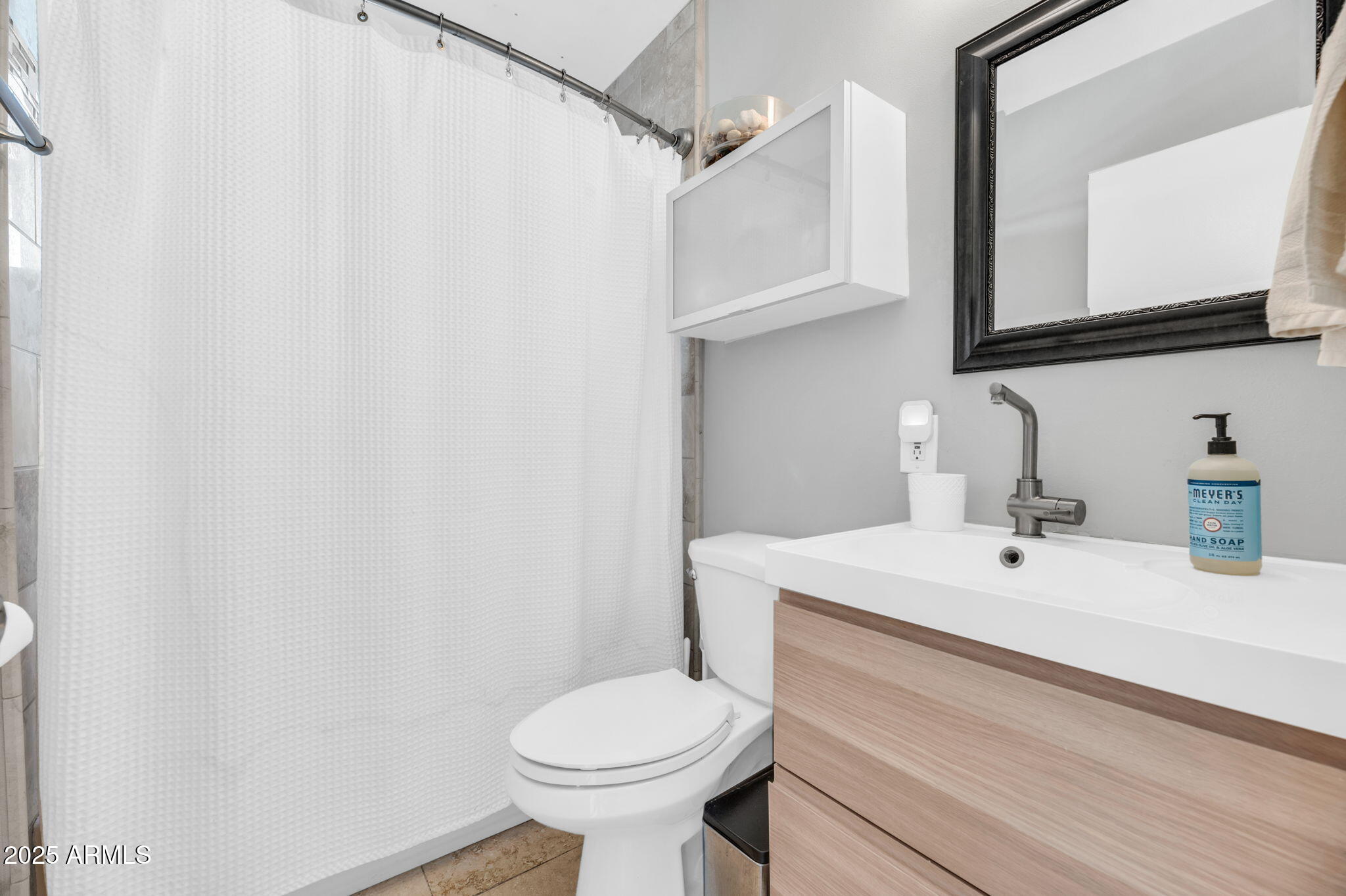4928 East Palm Lane Phoenix, AZ 85008 - Photo 12 of 17 a bathroom with a sink and a mirror