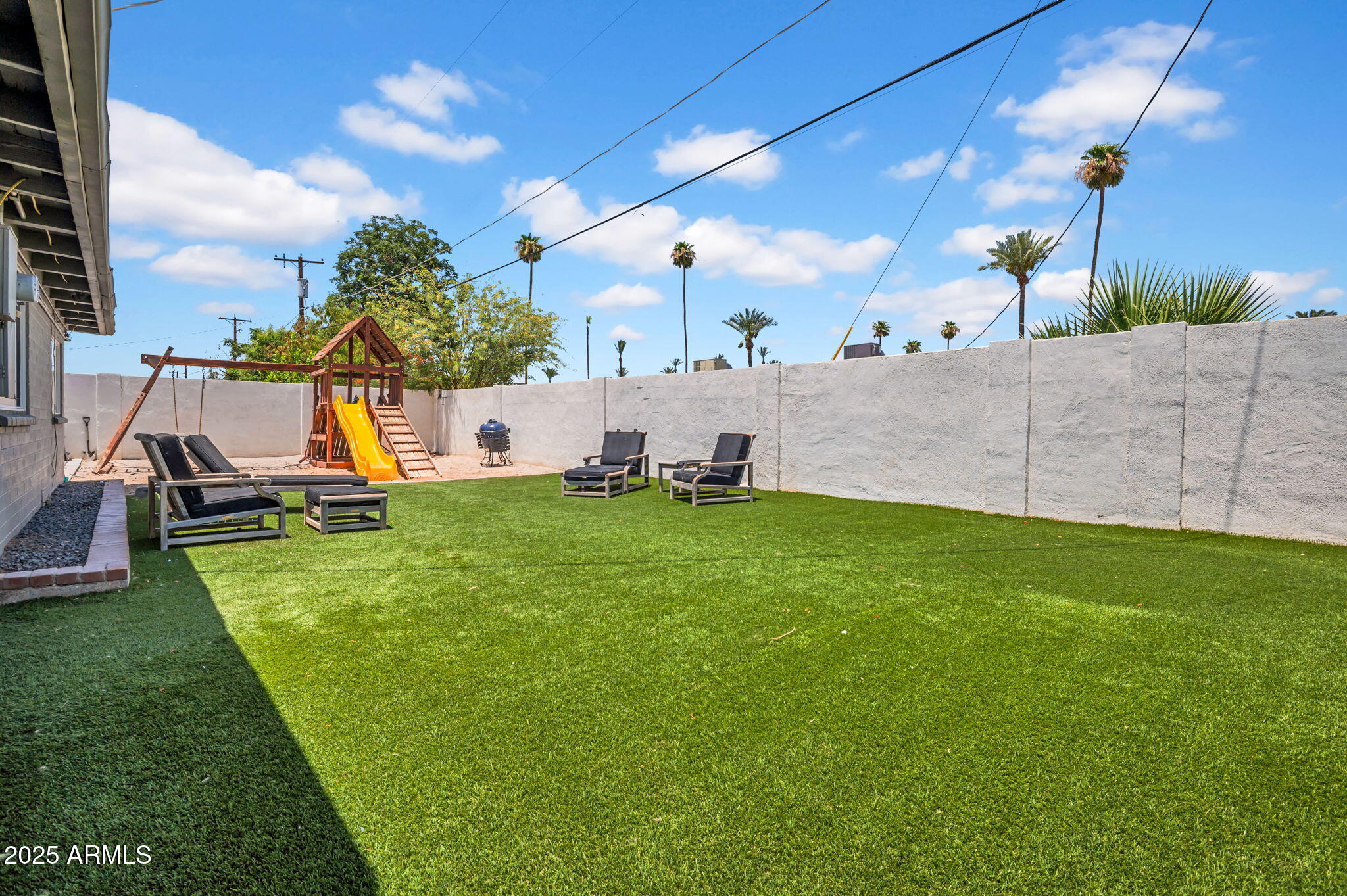 4928 East Palm Lane Phoenix, AZ 85008 - Photo 16 of 17 a view of a backyard with swimming pool