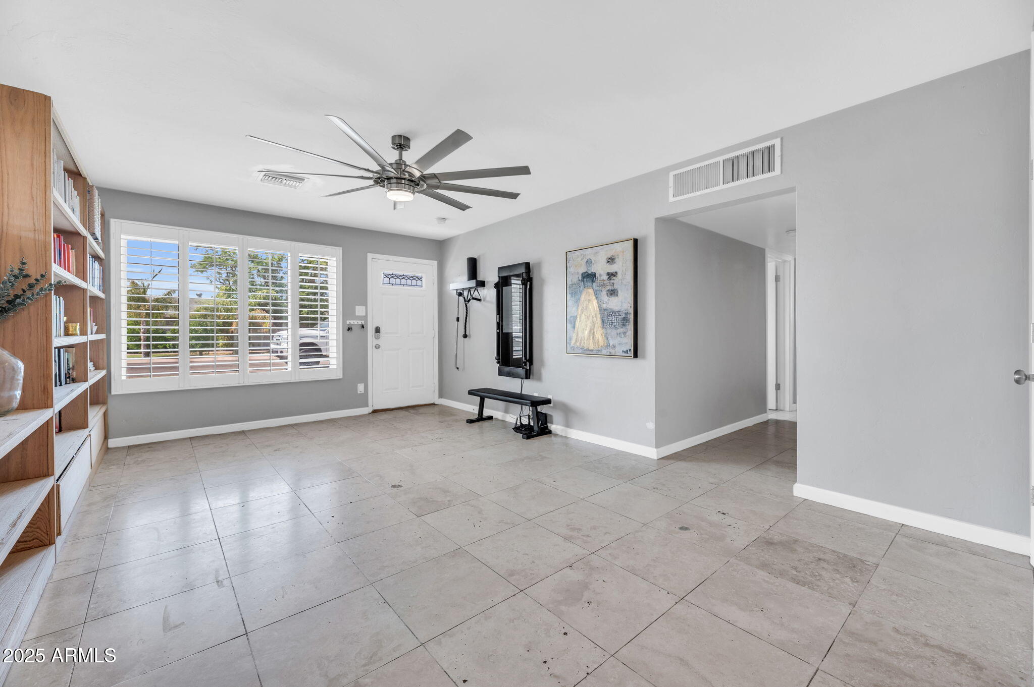 4928 East Palm Lane Phoenix, AZ 85008 - Photo 2 of 17 an empty room with windows and ceiling fan