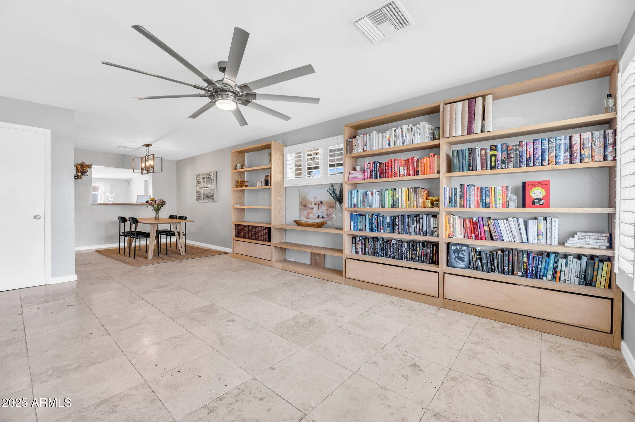 4928 East Palm Lane Phoenix, AZ 85008 - Photo 3 of 17 a living room with lots of furniture and a book shelf