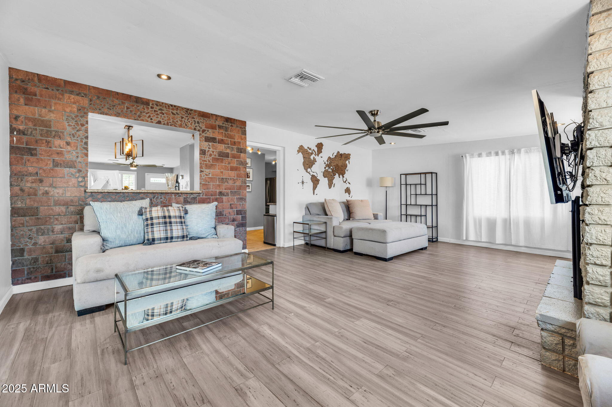 4928 East Palm Lane Phoenix, AZ 85008 - Photo 7 of 17 a living room with furniture and a wooden floor