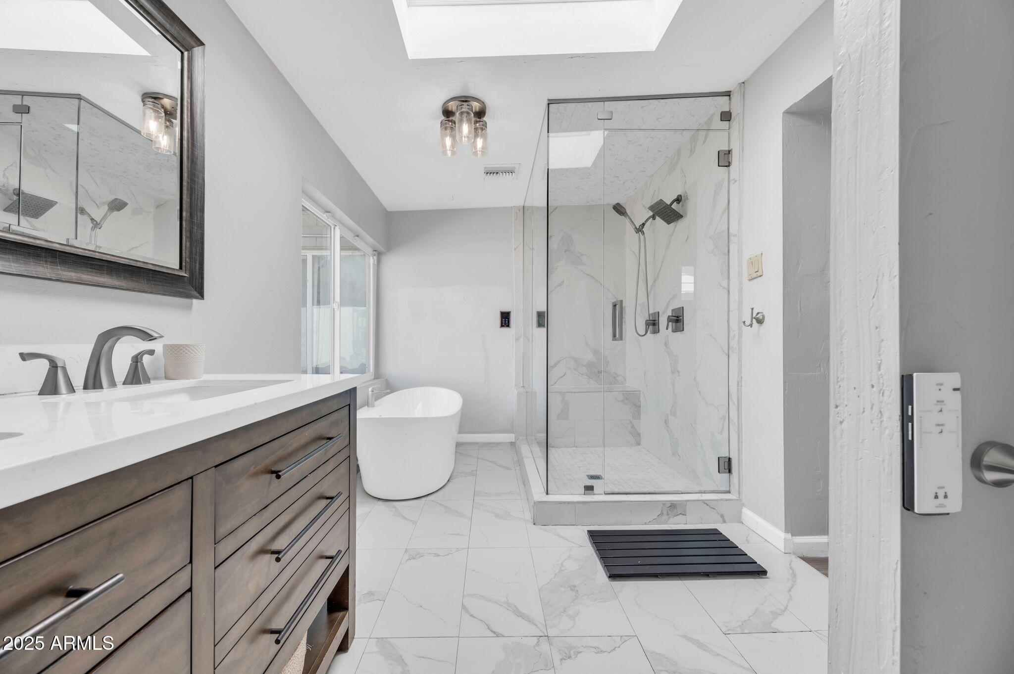 4928 East Palm Lane Phoenix, AZ 85008 - Photo 9 of 17 a bathroom with a granite countertop sink a toilet and shower