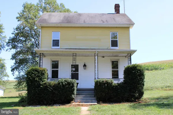 a front view of a house with yard