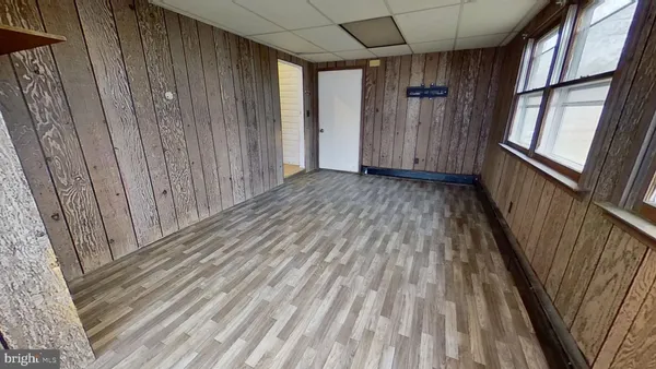 a view of wooden floor in an empty room