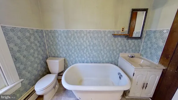 a bathroom with a toilet and a sink