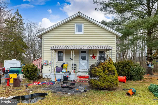 a front view of house with outdoor space