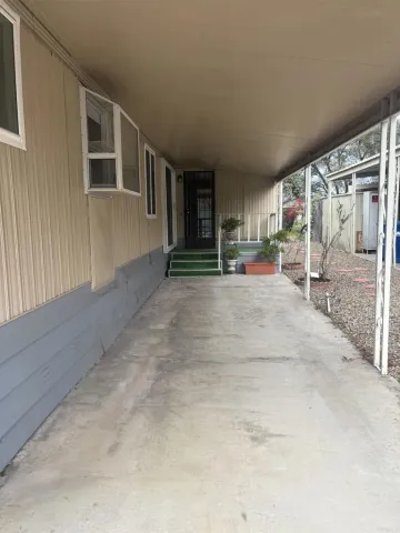 a view of a street with a building in the background