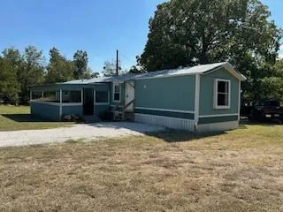 a dining room with furniture and a window