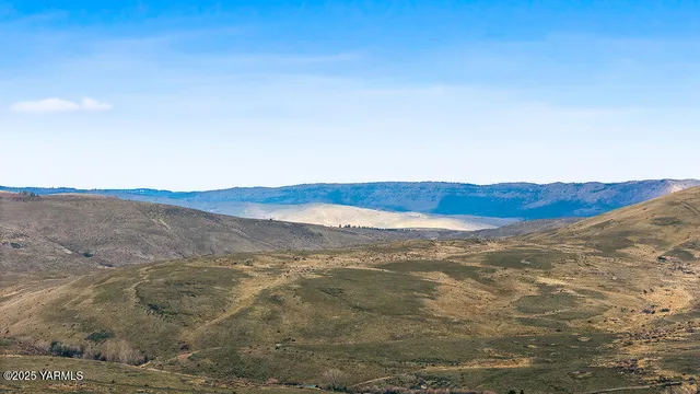 a view of ocean and mountains