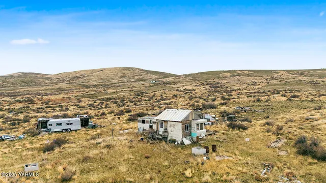 a view of mountain with an ocean
