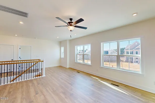 a spacious bathroom with a sink and a mirror