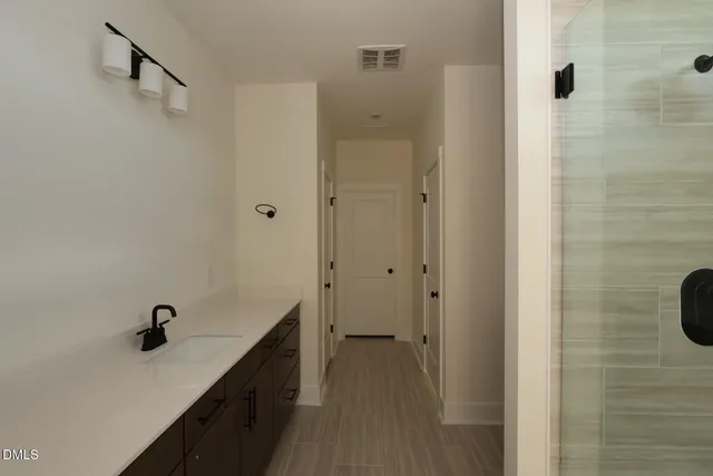 a bathroom with a sink and a shower