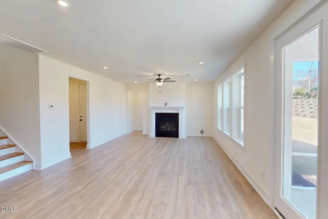 a view of livingroom with window ceiling fan and hardwood floor