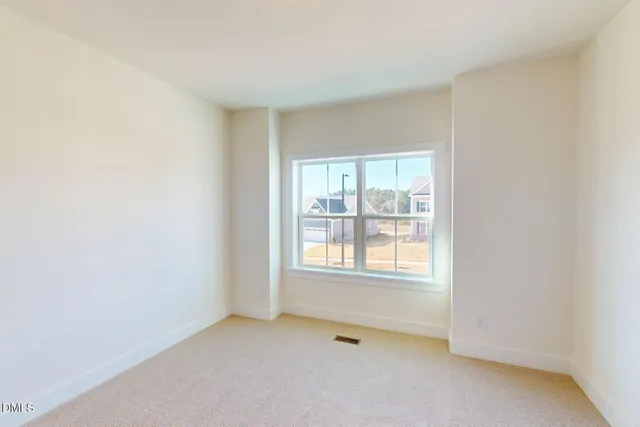 a bathroom with a bathtub shower sink mirror vanity and a toilet
