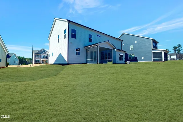 a kitchen with wooden cabinets and a stove top oven