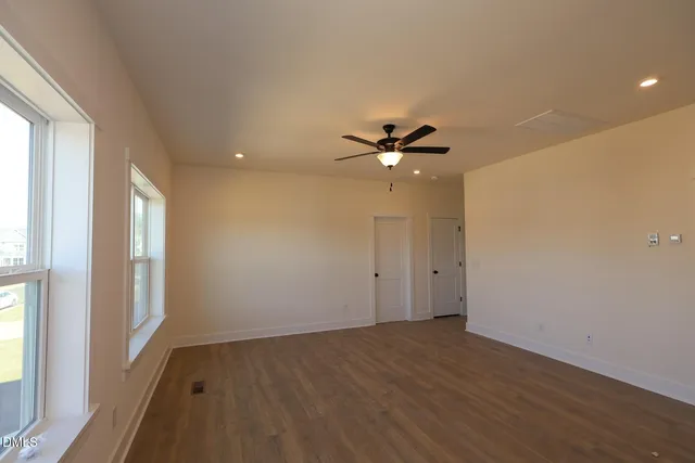 a kitchen with stainless steel appliances granite countertop a refrigerator a sink and a stove