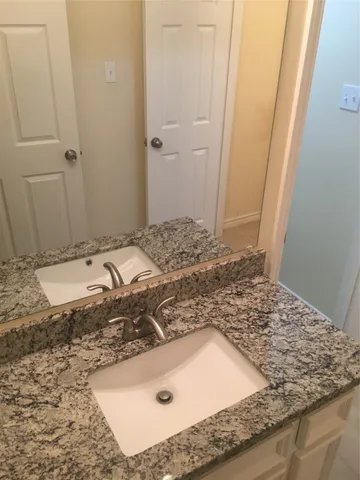 a white toilet sitting next to a shower curtain