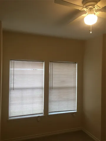 a view of a room that has a window in it