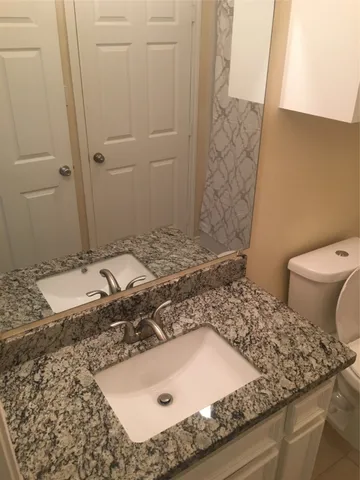 a bathroom with a sink and a toilet