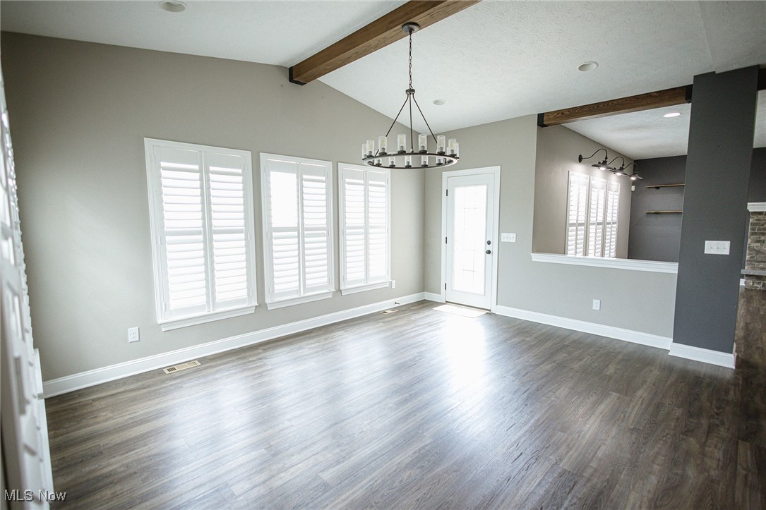 37328 Sandy Ridge Drive North Ridgeville, OH 44039 - Photo 14 of 39 Unfurnished room with a chandelier, dark wood finished floors, baseboards, and recessed lighting