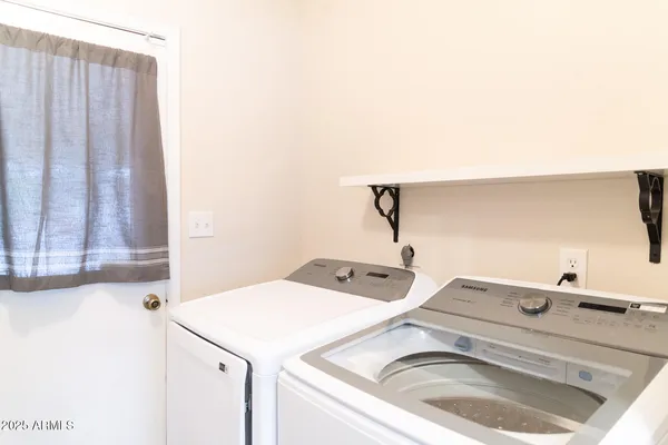 a utility room with dryer and washer