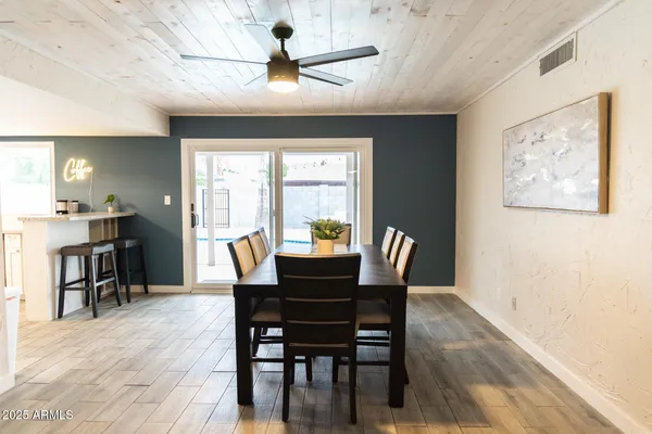 a view of a dining room with furniture window and wooden floor