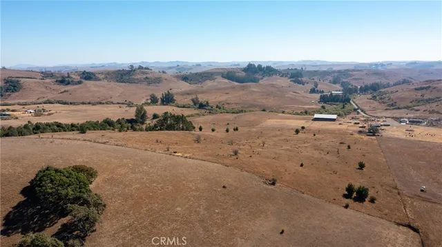 an aerial view of mountains with beach and mountain view
