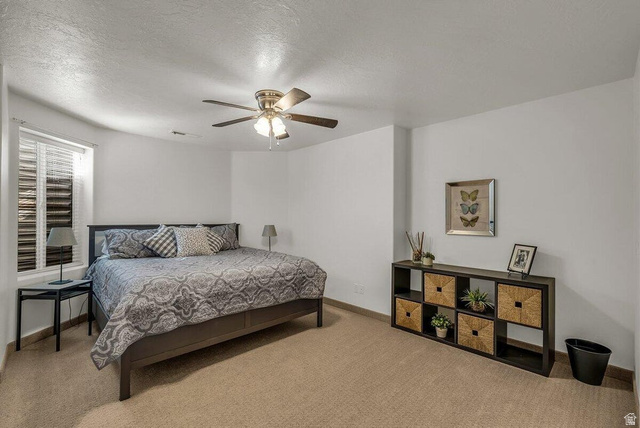 841 1010 S Street St. George, UT 84790 - Photo 25 of 33 Bedroom with carpet floors, a textured ceiling, and ceiling fan