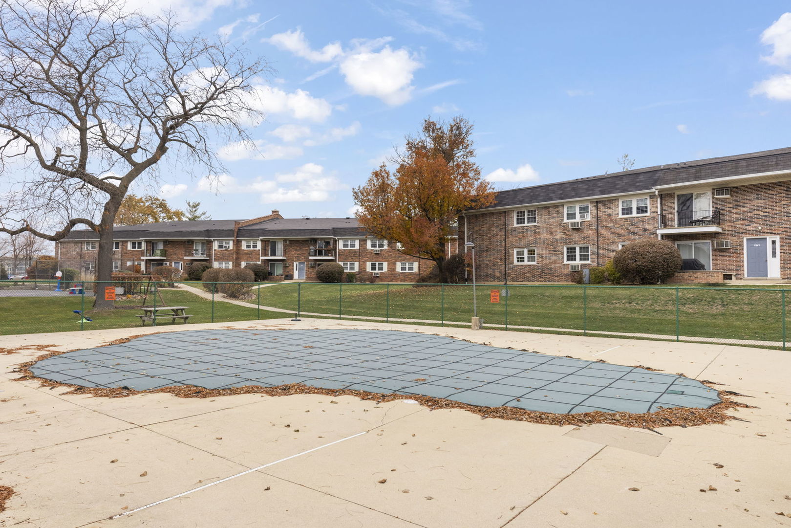 2343 Ogden Avenue, Unit 3 Downers Grove, IL 60515 - Photo 11 of 16 a view of a big house with a big yard and large trees