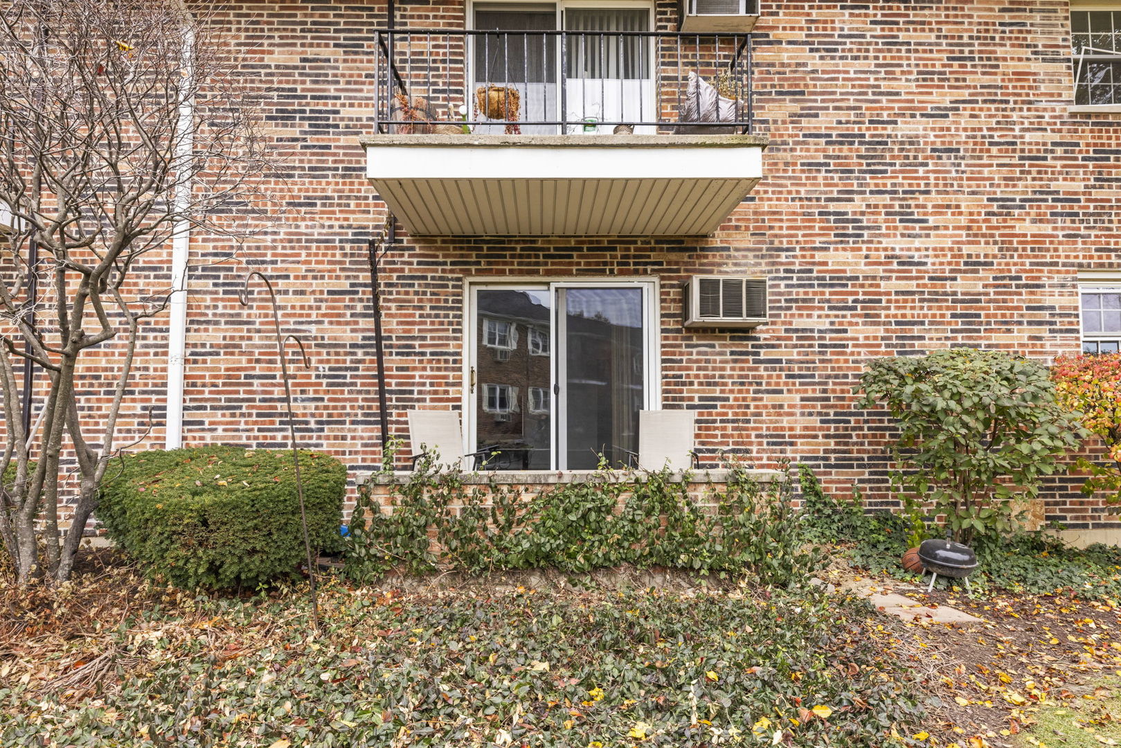 2343 Ogden Avenue, Unit 3 Downers Grove, IL 60515 - Photo 15 of 16 a front view of a house with a garden