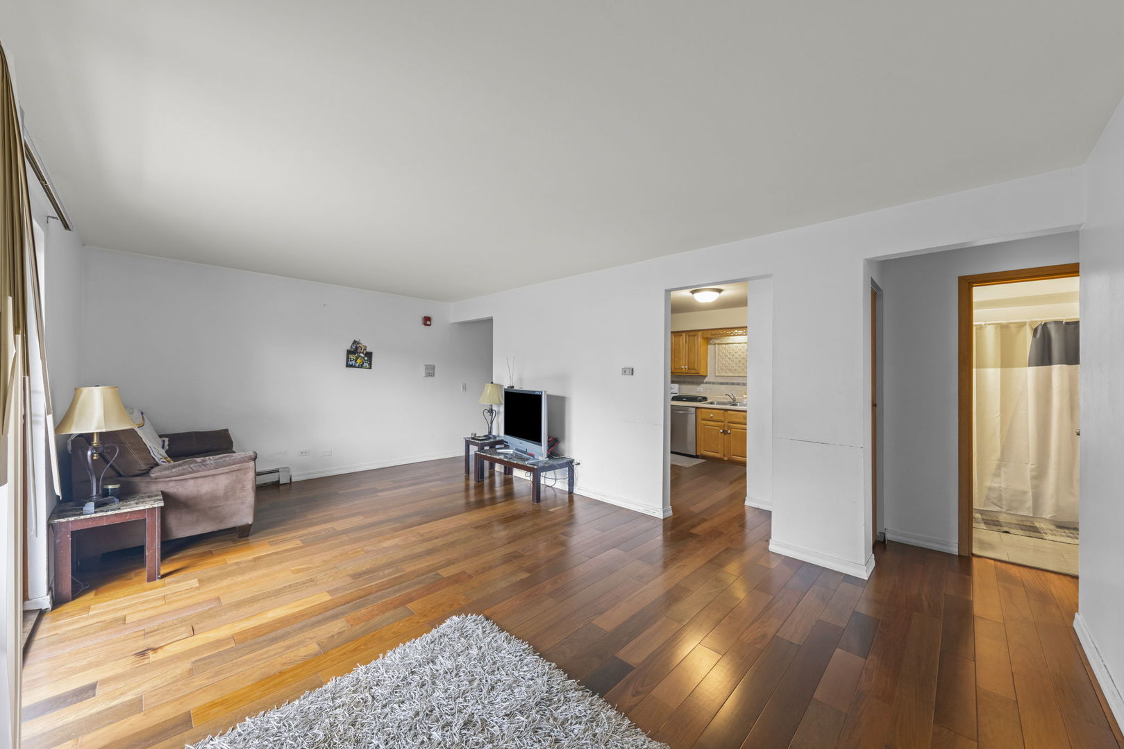 2343 Ogden Avenue, Unit 3 Downers Grove, IL 60515 - Photo 3 of 16 a living room with furniture and a wooden floor