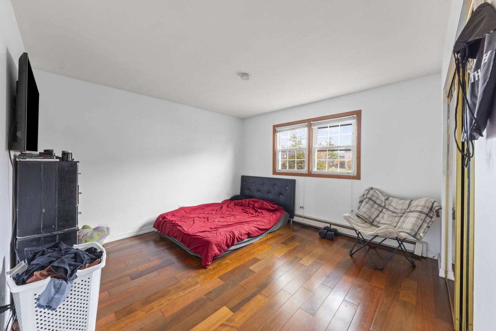 2343 Ogden Avenue, Unit 3 Downers Grove, IL 60515 - Photo 6 of 16 a bedroom with furniture and a flat screen tv