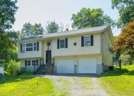 a view of a house with a swimming pool