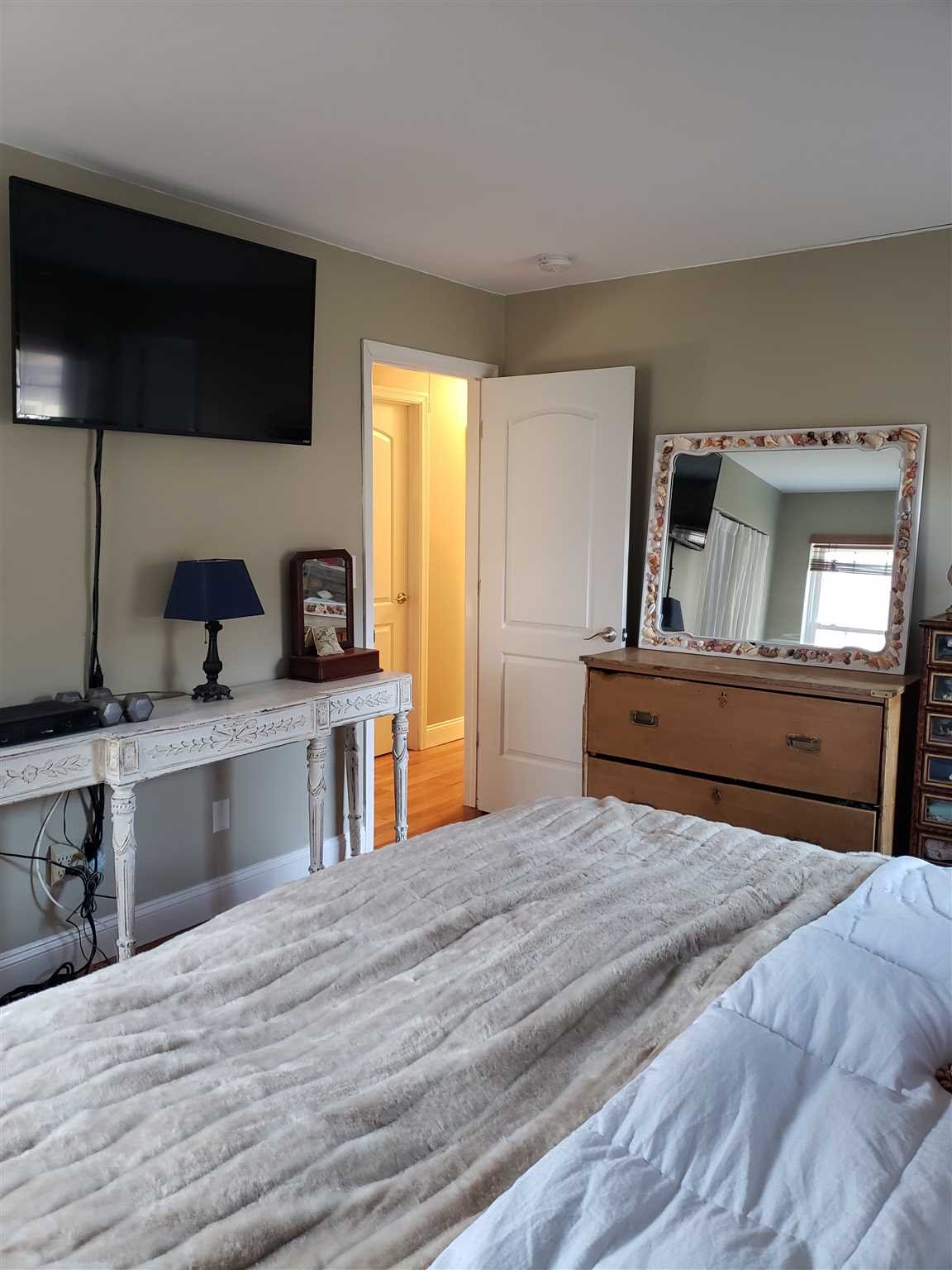 152 Belvedere Road Fishkill, NY 12508 - Photo 10 of 18 a bedroom with a bed and a flat screen tv