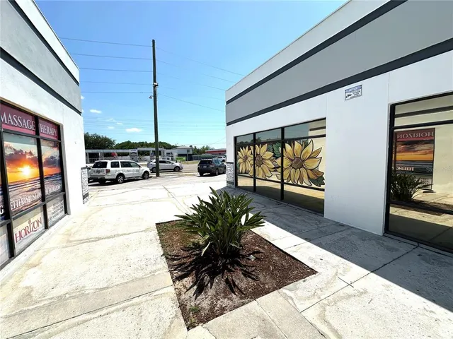 a lobby with furniture and floor to ceiling window