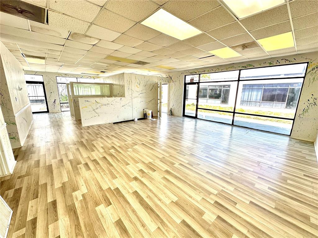 7135 State Road 52 Hudson, FL 34667 - Photo 5 of 14 a view of empty room with wooden floor and fan