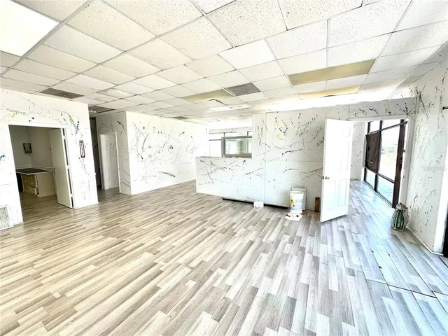 a view of a living room and wooden floor