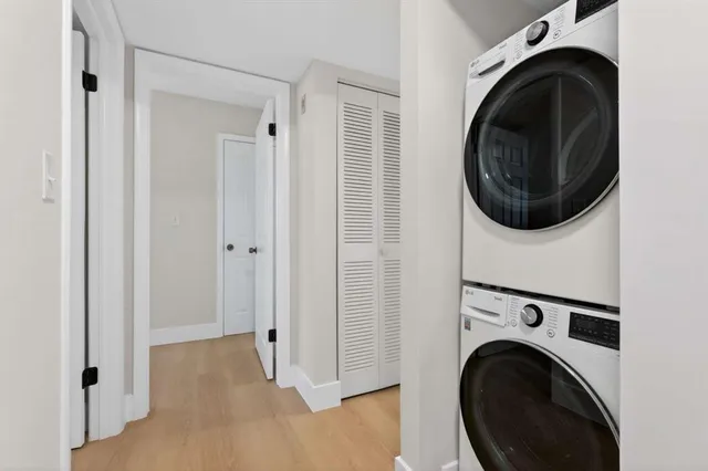 a view of a hallway with washer and dryer