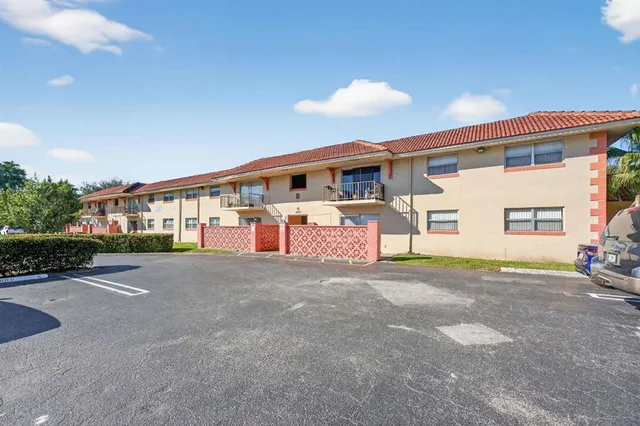 a front view of a house with a road and garage