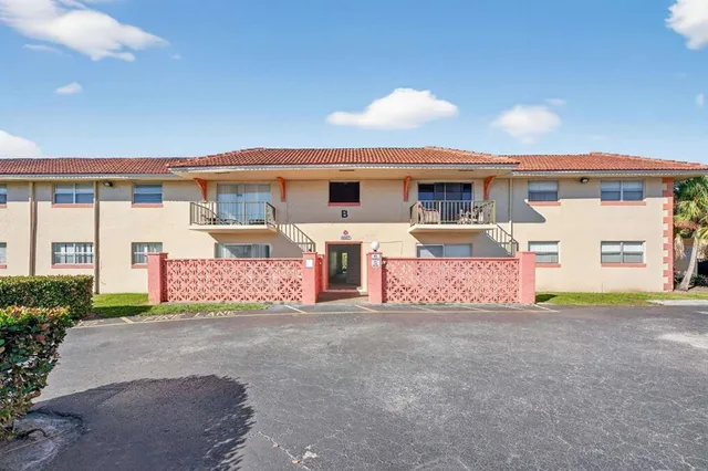a front view of a house with yard