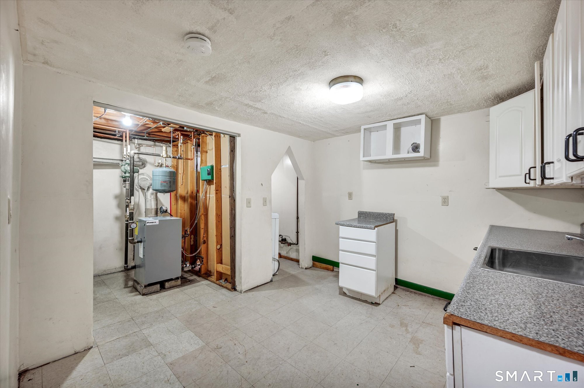 740 Rainbow Road Windsor, CT 06095 - Photo 35 of 40 a room with a chandelier and a window