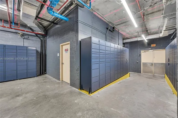 a living room with furniture and large windows