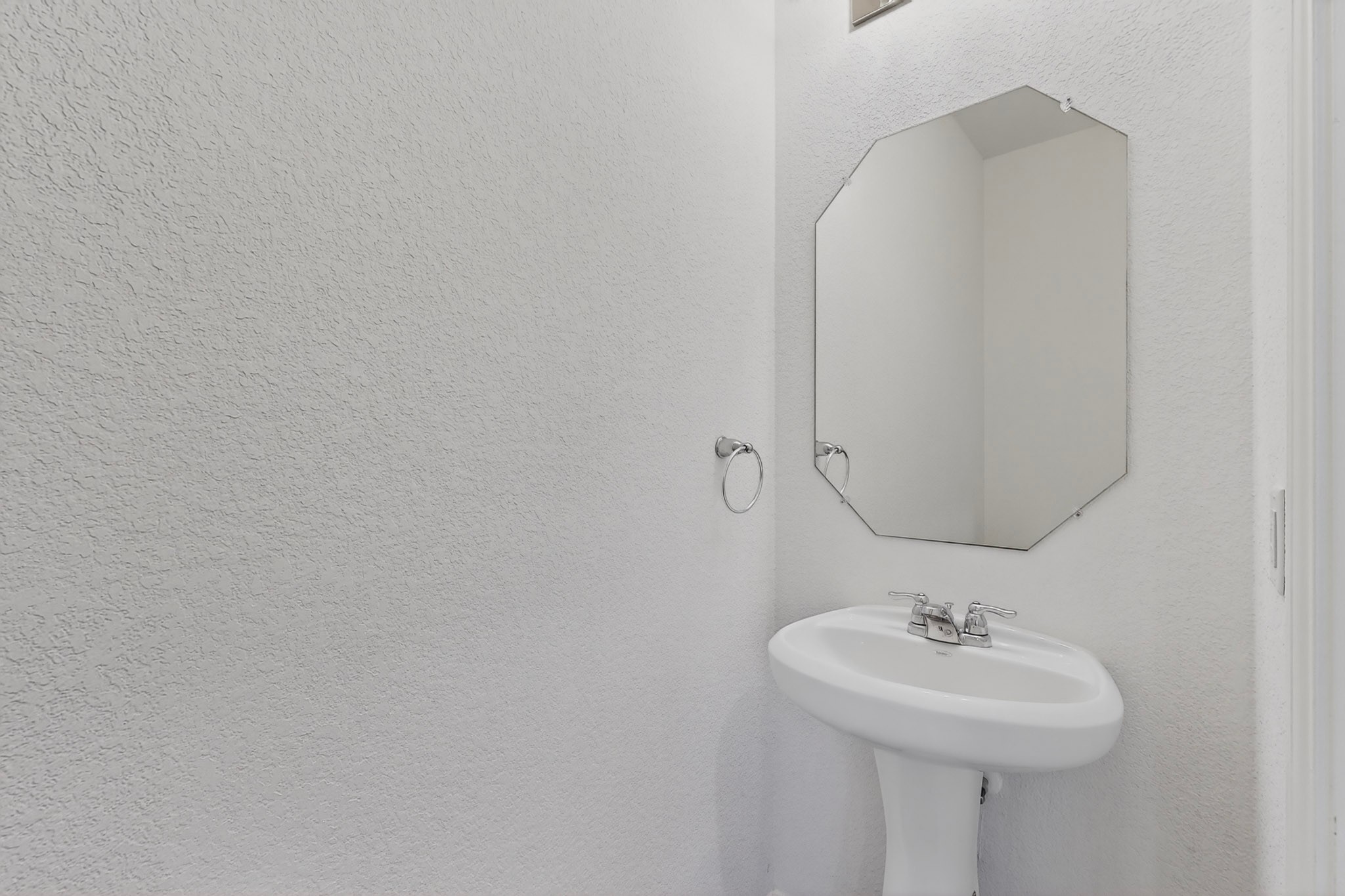 2524 Acoma Lane Leander, TX 78641 - Photo 11 of 27 a bathroom with a sink and mirror