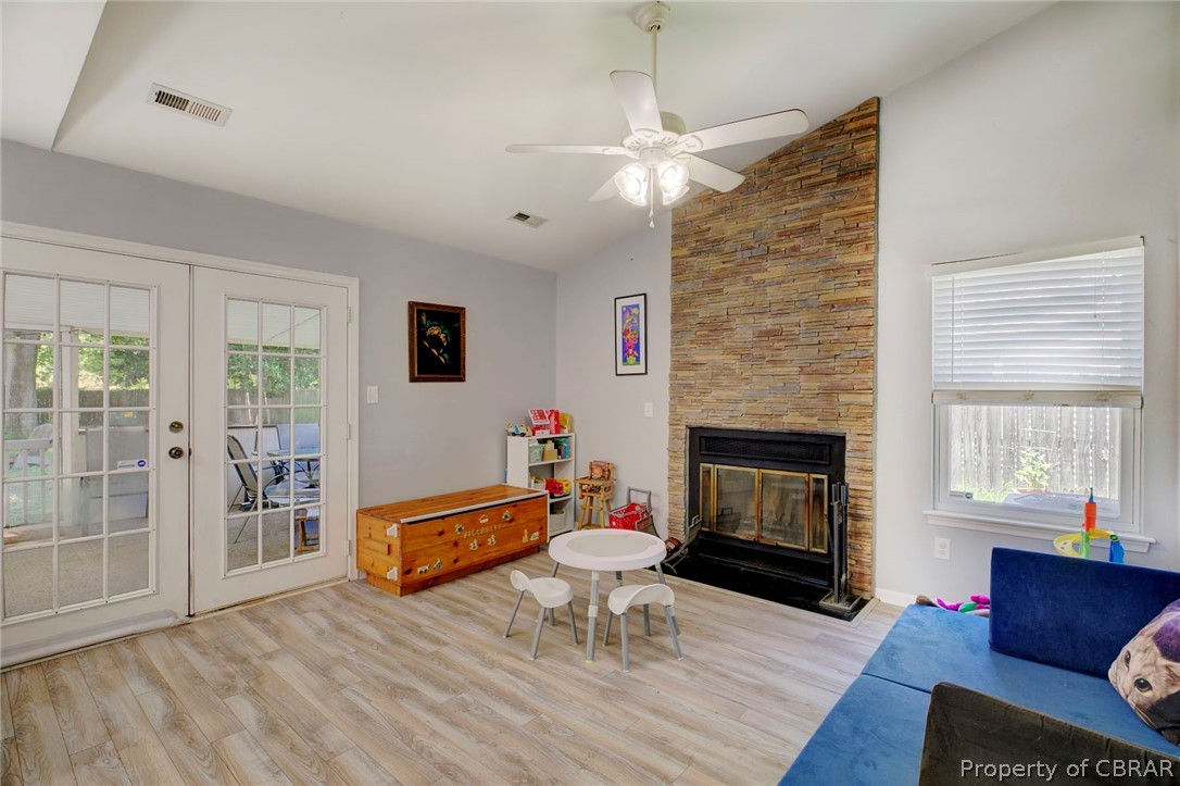 133 Springdale Way Hampton, VA 23666 - Photo 9 of 25 Living room with lofted ceiling, light hardwood / wood-style floors, a wealth of natural light, and ceiling fan