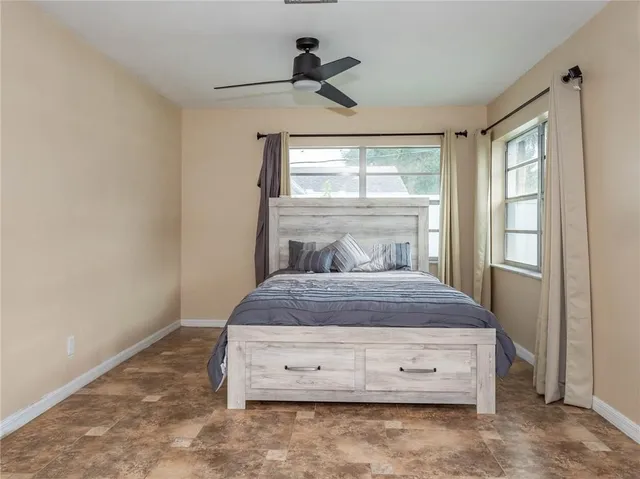 a bedroom with a bed and window
