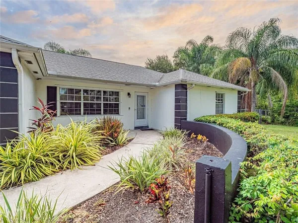 a view of a house with patio outdoor seating