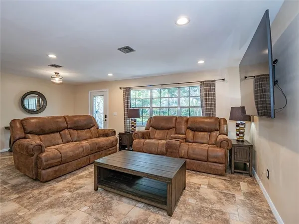 a living room with furniture and a window