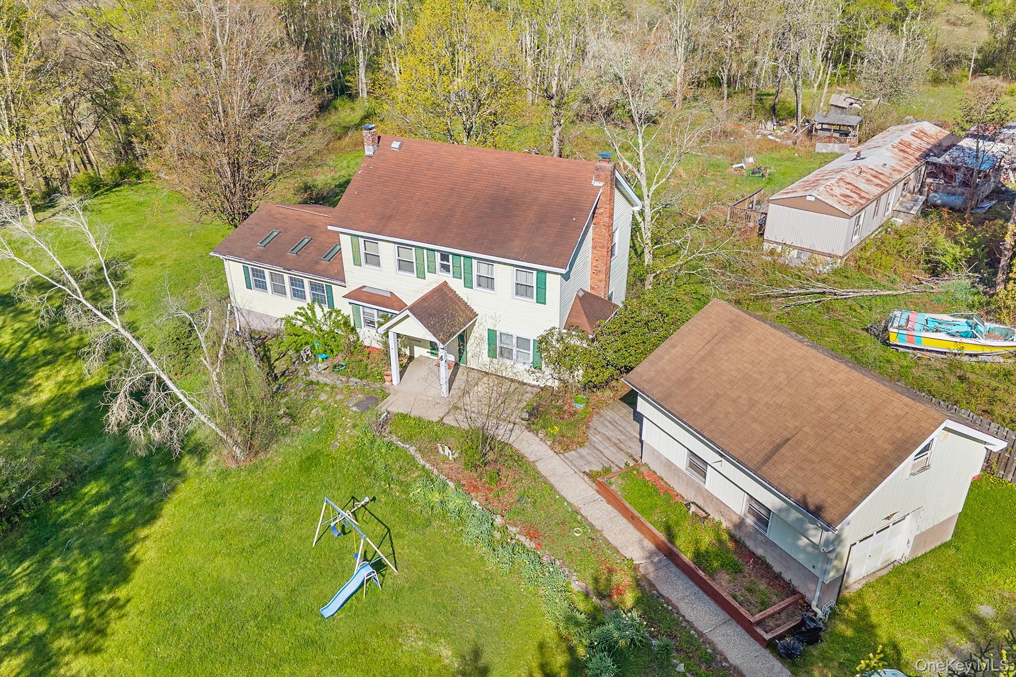 43 Taylor Road Parksville, NY 12768 - Photo 3 of 29 Two-story residence with a covered front entry and shuttered windows