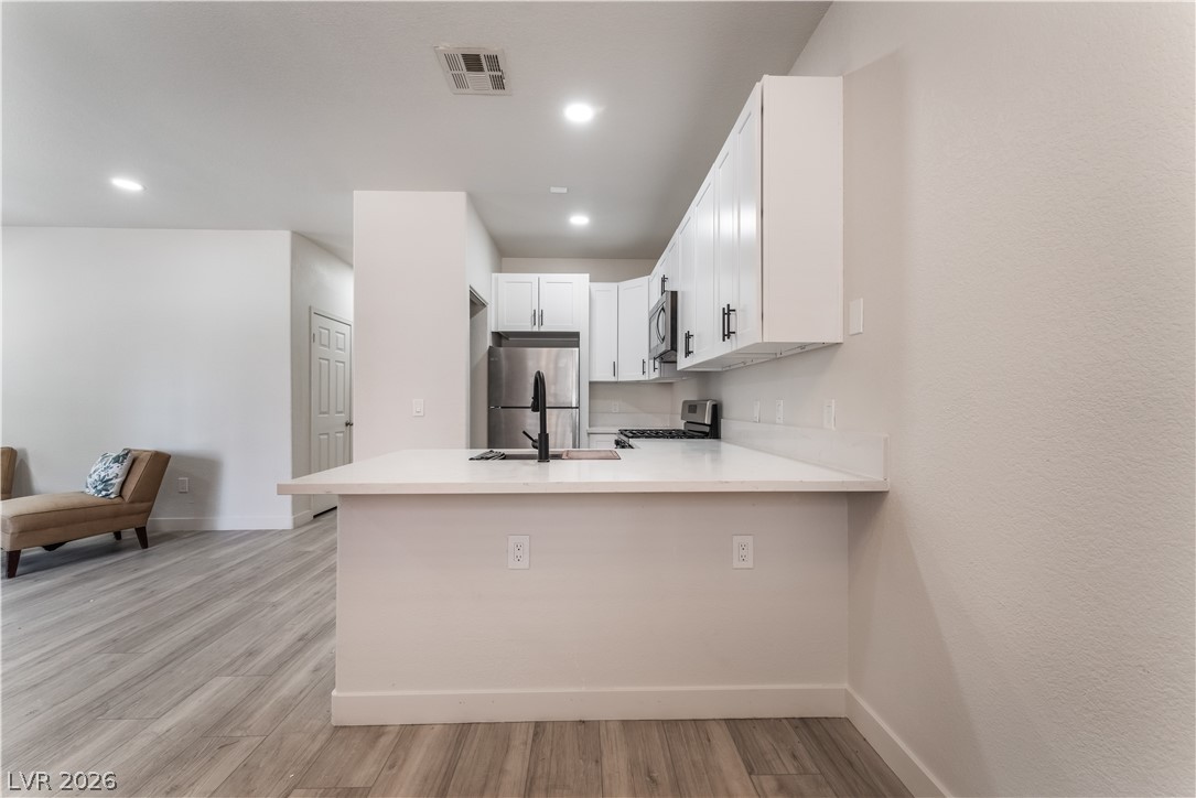 4730 East Craig Road, Unit 1058 Las Vegas, NV 89115 - Photo 10 of 30 A well-appointed kitchen island offers additional counter space, perfect for entertaining.