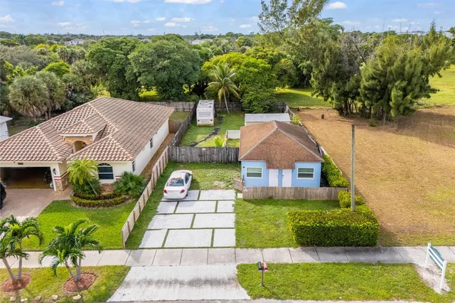 a aerial view of a house with a yard